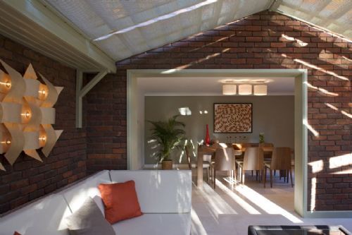 Woven Wood blinds to ceiling and side windows of a wooden conservatory 