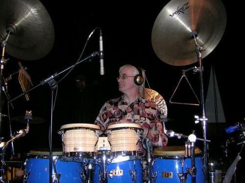 Stuart Wood playing percussion live on-stage - Training Service Providers Loughborough
