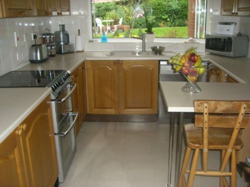 A kitchen and dining room kncked through to make one room