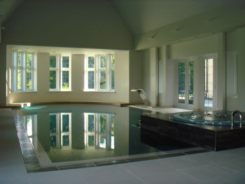 Deck level indoor swimming pool installation. - Swimming Pool Construction Companies Warrington