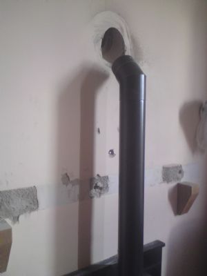 Wall cored at an angle for a flue pipe. - Drilling Companies Belfast