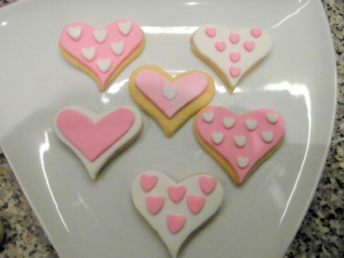 Vanilla heart shaped biscuits decorated with fondant icing - Occasion Cake Makers Chessington