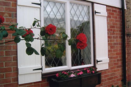 UPVC Board & Batten decorative shutters - Shutter Companies Brandon