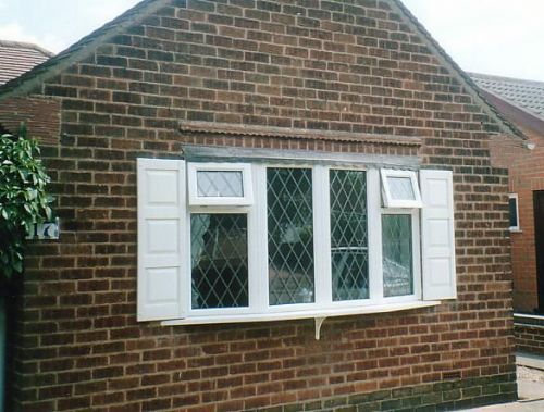 UPVC Custom Panel decorative shutters - Shutter Companies Brandon