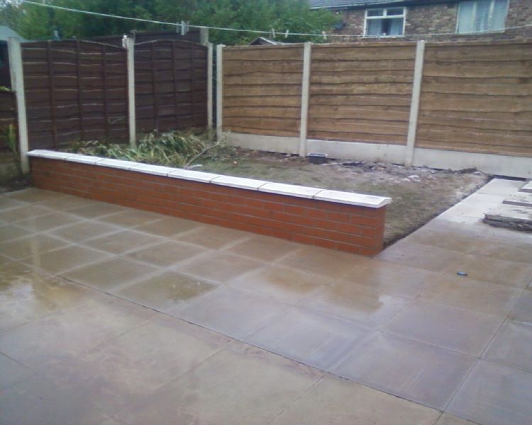 Flagging job .garden wall and fence panels and posts erected