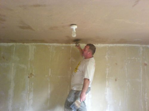 Plastering ceiling.
