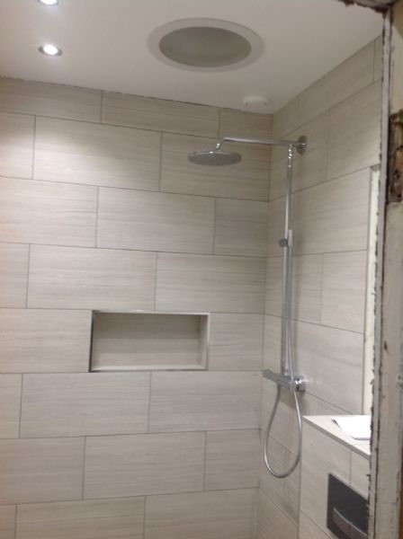 Rectified tiles, look at the finish. Perfectly tiled, dead straight corners , nice alcove. Velux sun tunnel to allow natural light