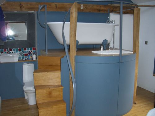 Roll Top Bath on Raised Platform in Bedroom Arundel West Sussex