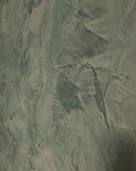 Glossy Venetian plaster wall finish with deep marble texture.