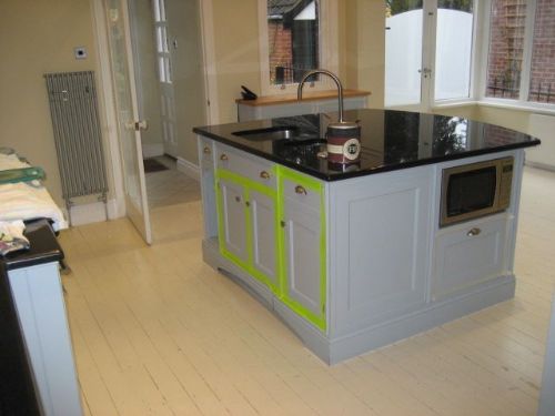 BEFORE white painted floor boards look unsightly in this beautiful kitchen