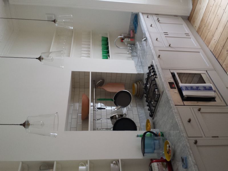 Bespoke kitchen units, worktop and tiling. Kitchen relocation including new electrical rewiring, gas and water.