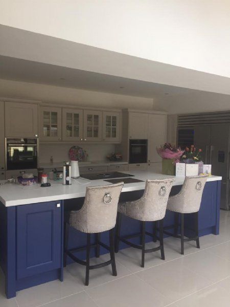 Touch of colour added with a blue island & plenty of storage.
