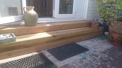 Construction of steps from patio doors into the garden.