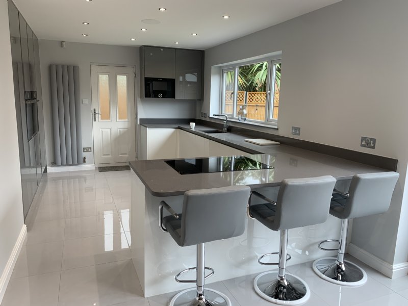 Bretts True Handleless kitchen with white shimmer quartz tops.