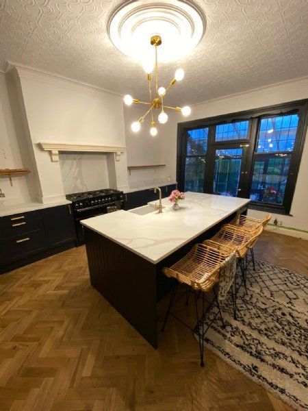 Mr Stubbs beautiful indigo shaker kitchen with Calacatta quartz tops.