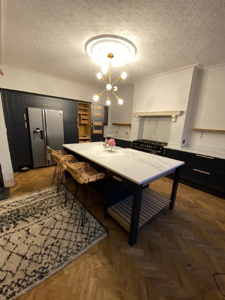 Mr Stubbs beautiful indigo shaker kitchen with Calacatta quartz tops.