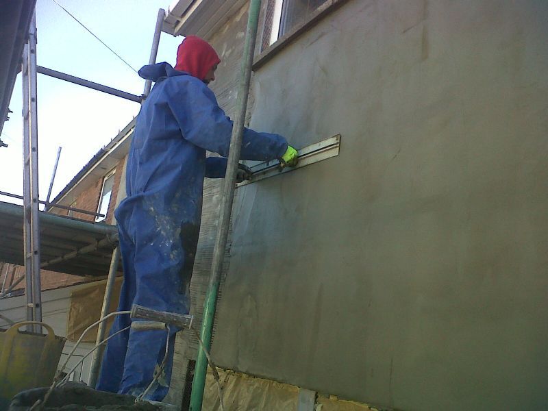 Sand, cement and co polymer render with embedded fiberglass mesh, once dried and cured (usually 2 weeks max) can be coated with one of our wall coatings.