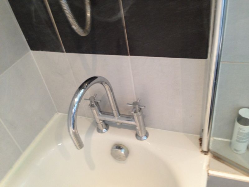 Bath fitting and tiling.