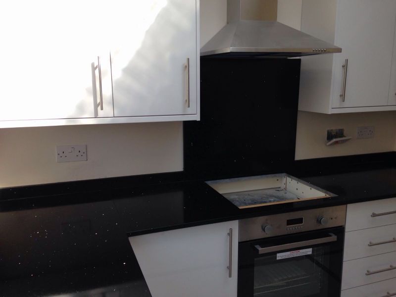 Mtstones black mirror flecks quartz worktop.