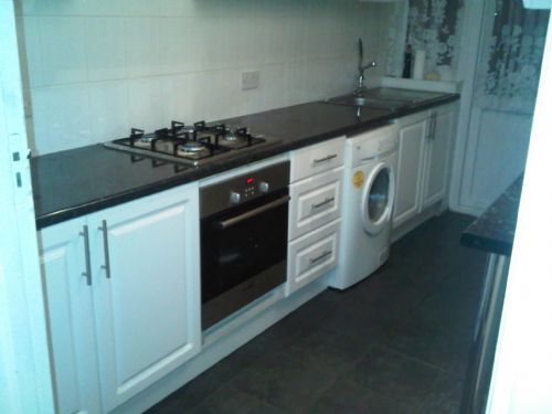 Put original kitchen in its original place with new cooker and oven.