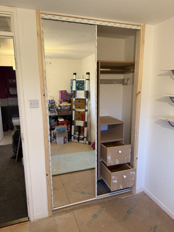 Cupboard insert with sliding doors.