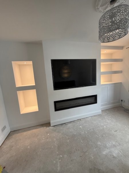 Media wall built to suit the existing chimney breast.